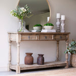 Three-drawer console table made from reclaimed, weathered pine
