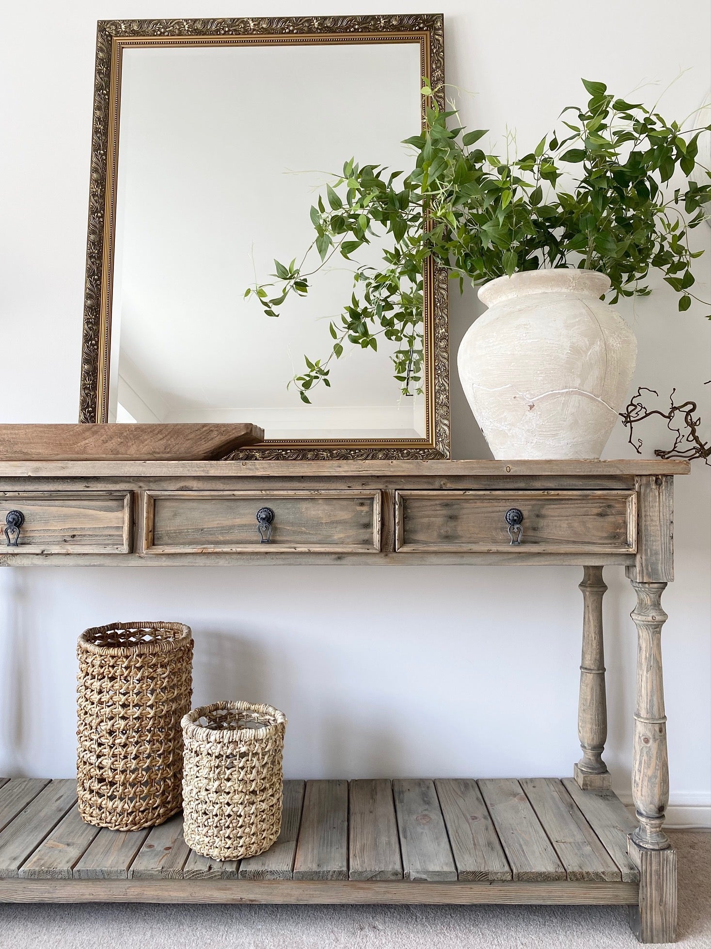 Three-drawer console table made from reclaimed, weathered pine