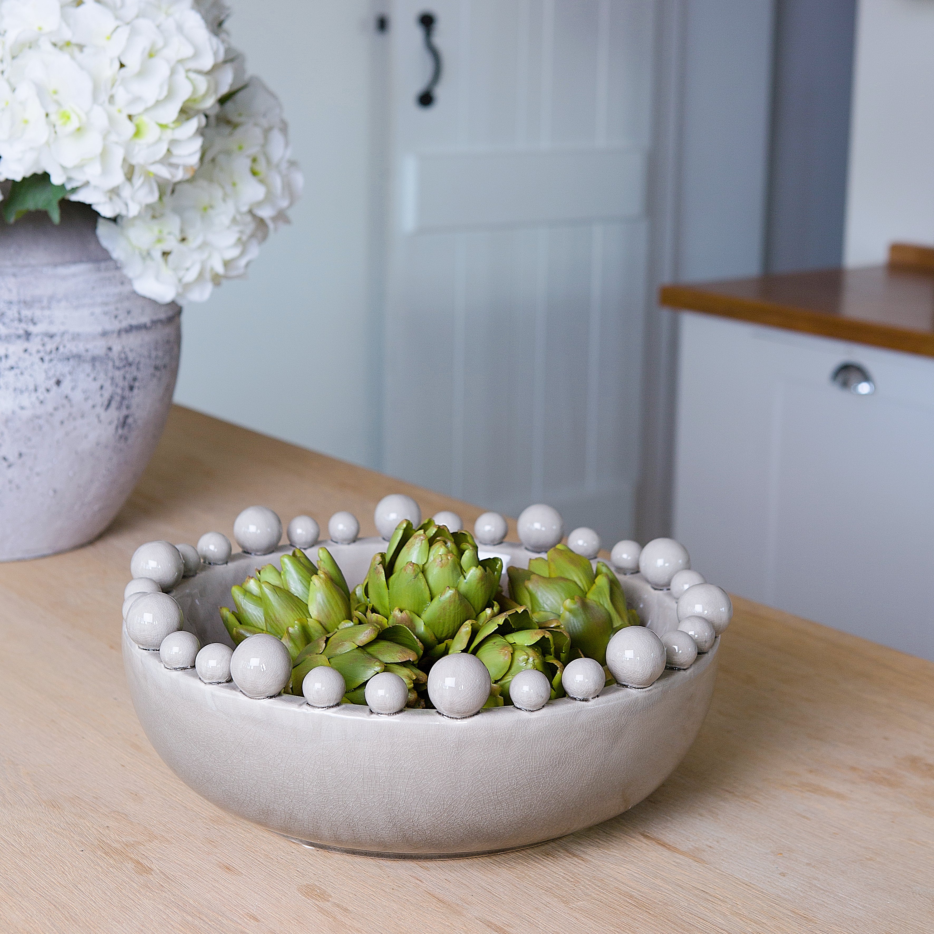 Beautiful ceramic bowl with balls around the rim.