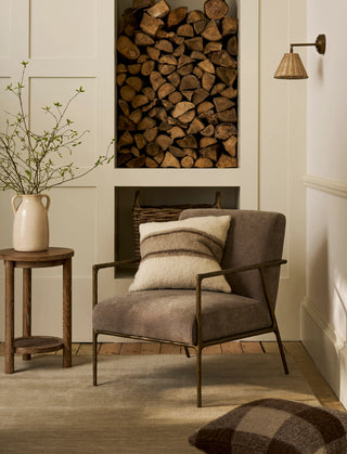Guiting antique brass armchair with neutral cushions
