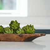 A set of three decorative faux green artichokes.