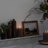With a sleek, slender design, these exquisite ceramic jars exude a rich and opulent vintage brown hue.