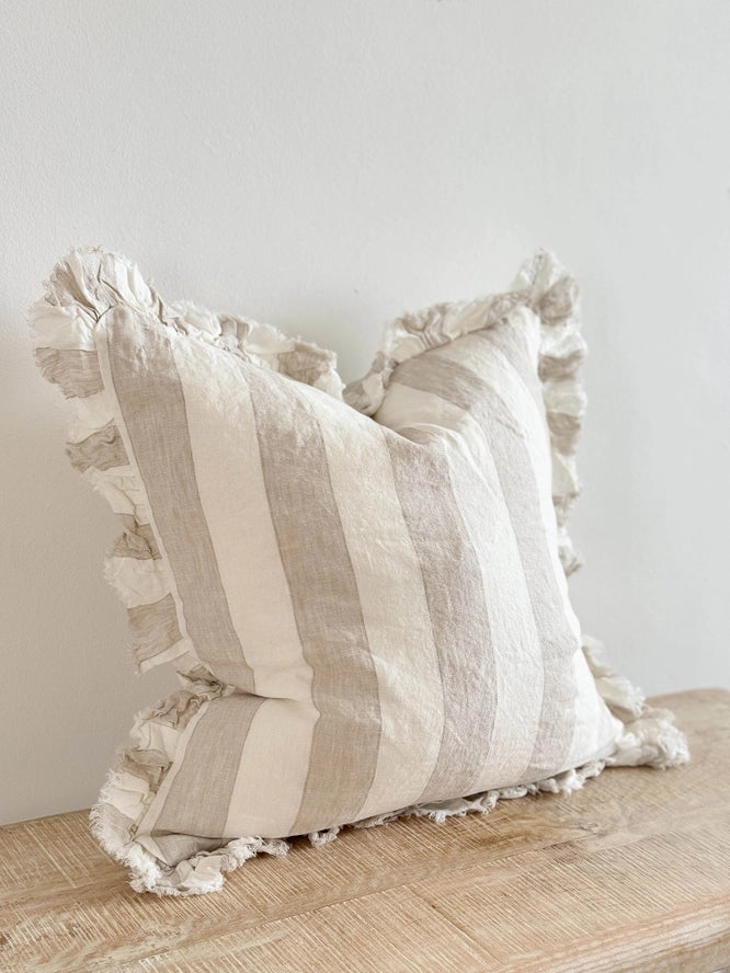 Beige and cream striped cushion with ruffled edges