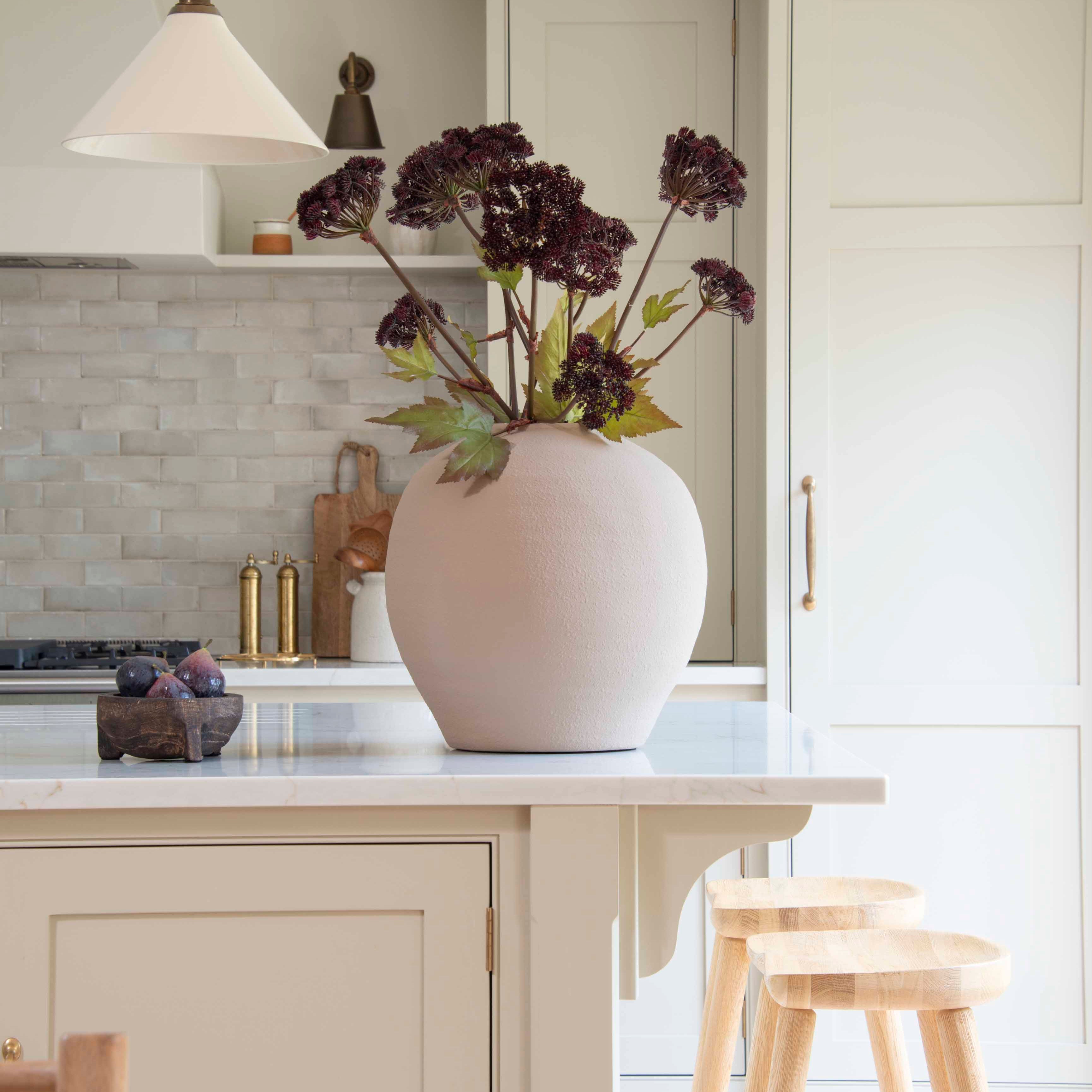 Angelica seed heads in a large vase on the kitchen counter.
