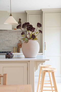 Angelica seed heads in a large vase on the kitchen counter.