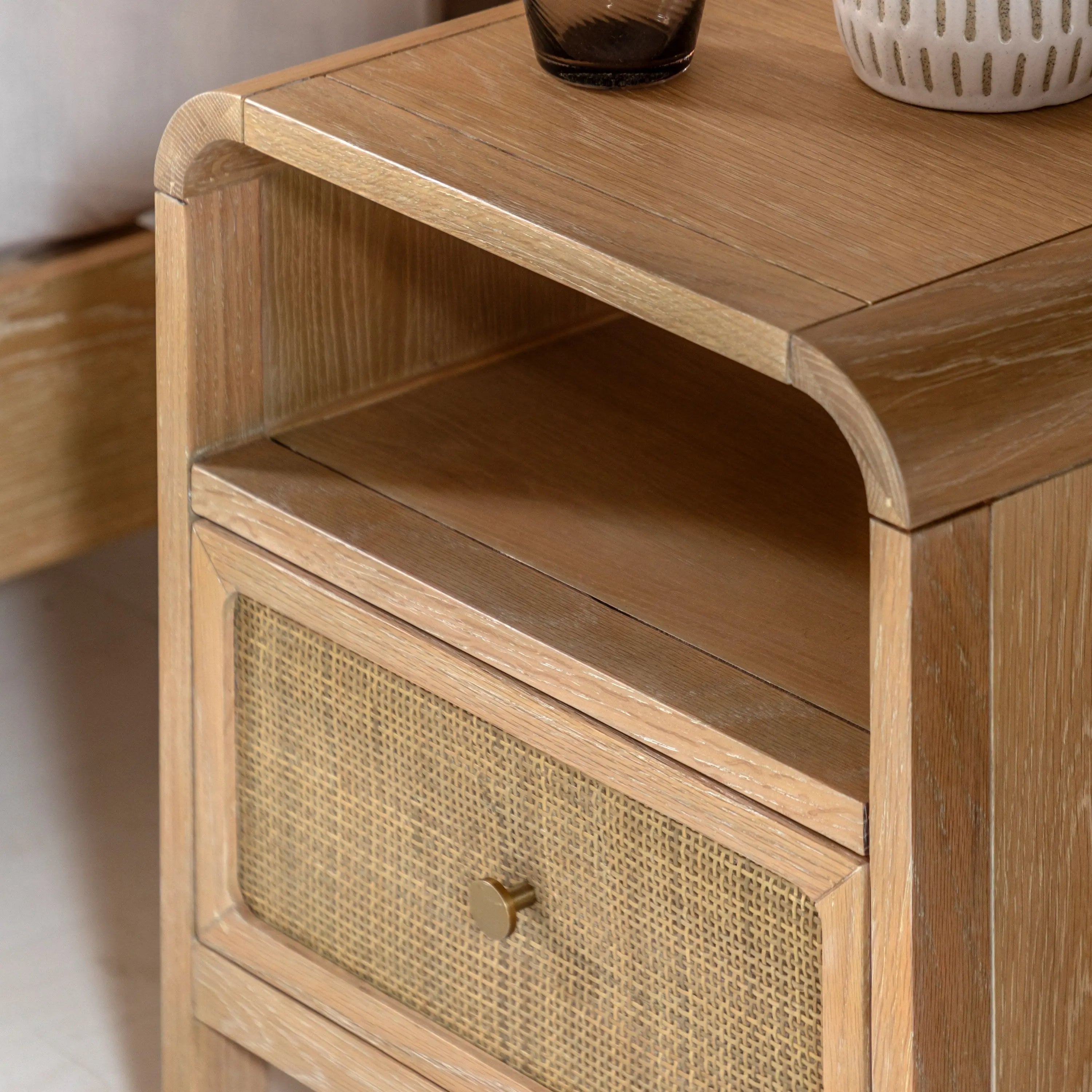 Close up of Cheltenham bedside rattan drawer and curved top