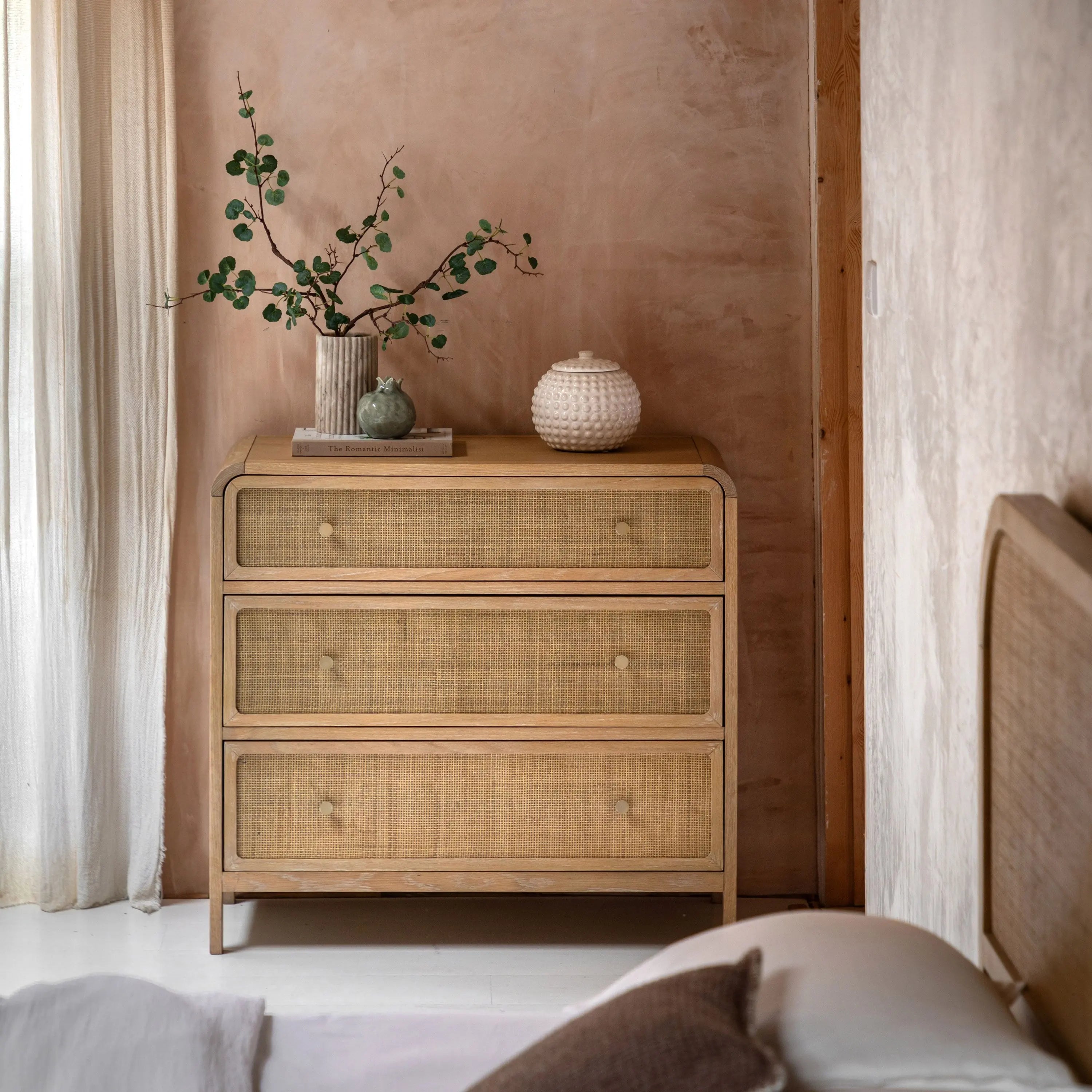 Cheltenham rattan chest of drawers in lime washed oak styled in bedroom