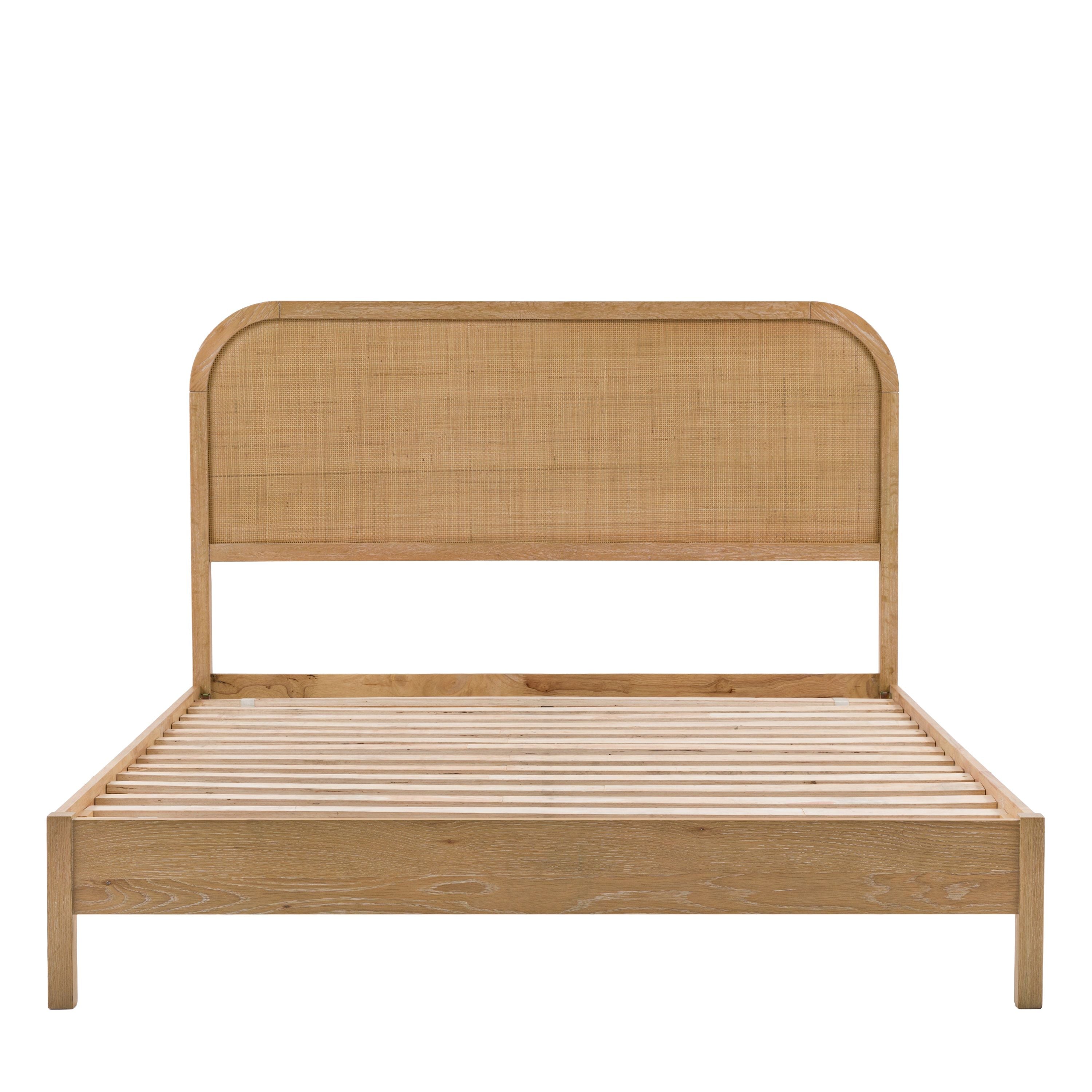 Wooden bed frame with woven headboard on a white background