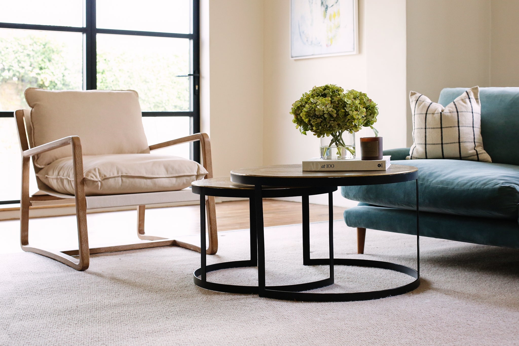 A beautiful set of two occasional tables with antiqued black Metal legs and Bronzed Tops