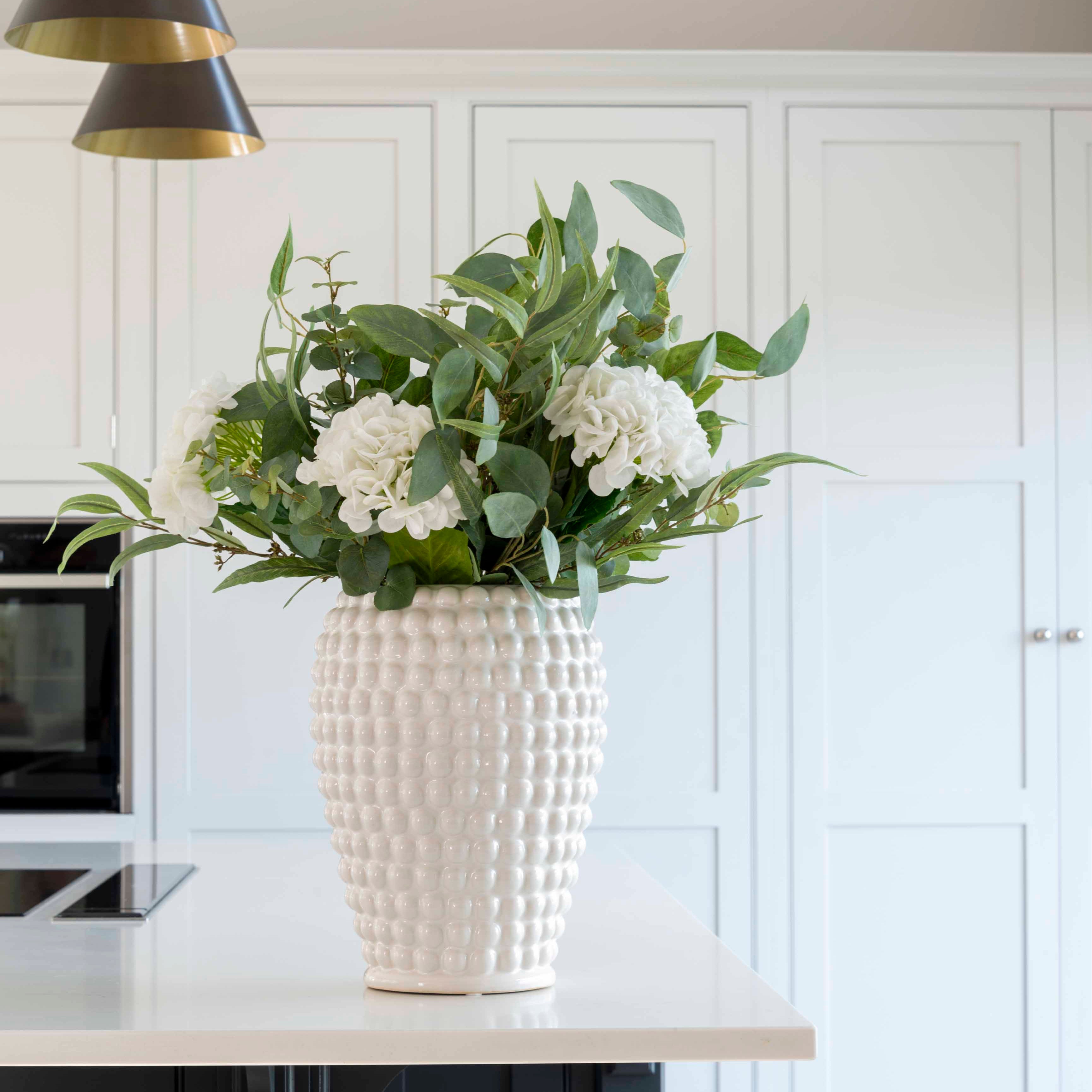 A beautiful mixture of natural eucalyptus, silver dollar eucalyptus and luxury white hydrangeas.