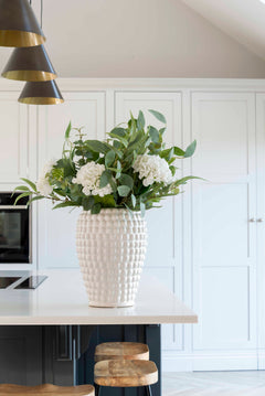 A beautiful mixture of natural eucalyptus, silver dollar eucalyptus and luxury white hydrangeas.