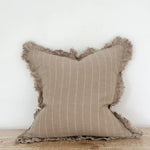 A beautiful linen cushion in taupe with white stripe running through and ruffled edges