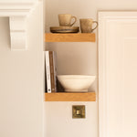 Papier mache bowl on a bookshelf