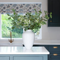 A stunning tapered white stoneware vase