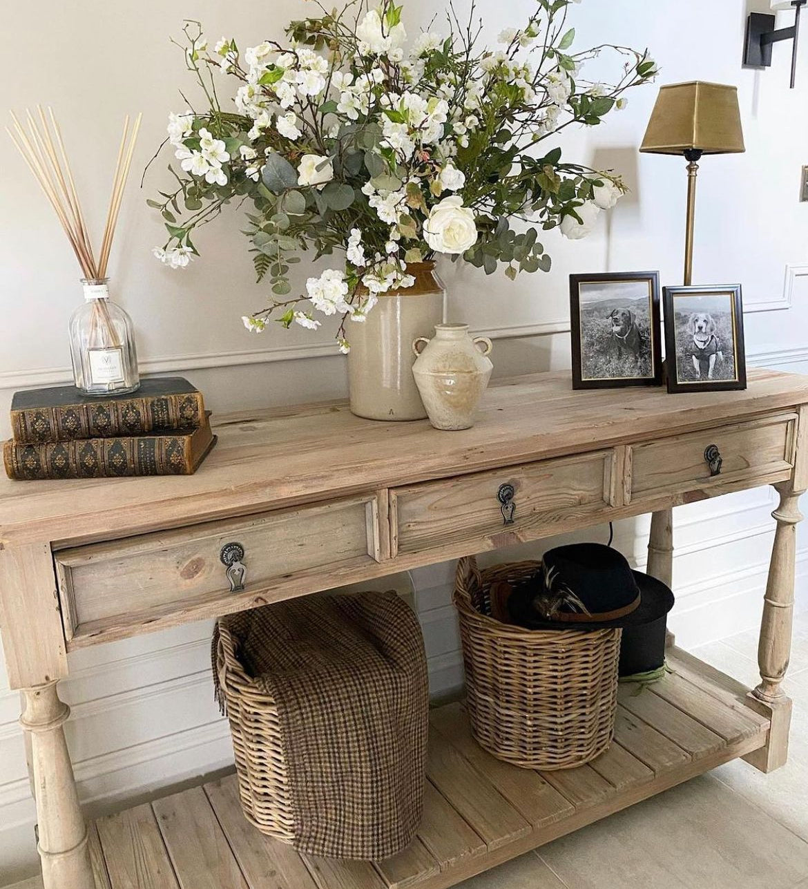 Three-drawer console table made from reclaimed, weathered pine