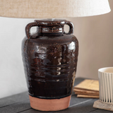 Close up of Charles Ted Adcote Rustic Brown Ceramic Table Lamp base with linen shade