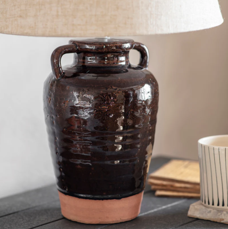 Close up of Charles Ted Adcote Rustic Brown Ceramic Table Lamp base with linen shade