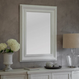 Anderson Classic White Framed Wall Mirror styled above console table with lamp and flowers