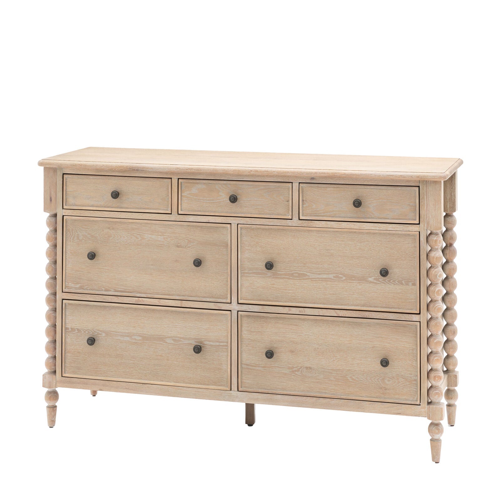 Antoine 7-drawer dresser in limewashed oak with turned legs – spacious rustic and elegant storage solution"