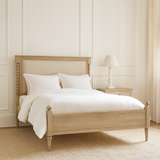 Antoine bed frame in limewashed oak with upholstered headboard and turned posts – elegant French country bedroom furniture