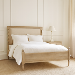 Antoine bed frame in limewashed oak with upholstered headboard and turned posts – elegant French country bedroom furniture