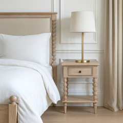 Antoine bedside table in limewashed oak with turned legs, single drawer, and open lower shelf – rustic and elegant bedroom furniture