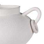 Close-up of matte white ceramic vase with textured finish and circular loop handle detail