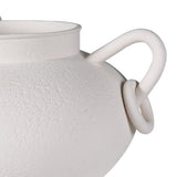 Close-up of matte white ceramic vase with textured finish and circular loop handle detail