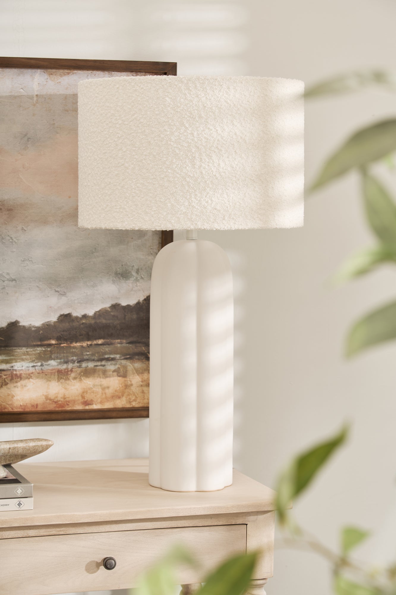Minimalist Arlo Bouclé Table Lamp styled with artwork and neutral décor