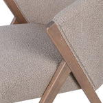 Close-up of the wooden frame and upholstery joint on the Arlo chair