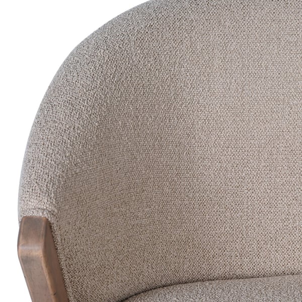 Detail of curved upper backrest and textured taupe fabric