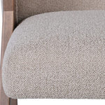 Seat close-up showcasing plush foam cushioning and fabric texture