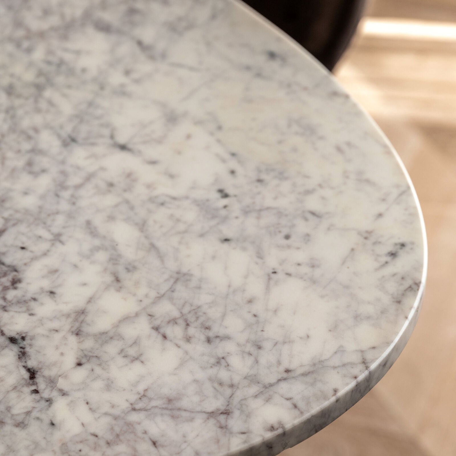 Close-up detail of the natural veining on the marble tabletop
