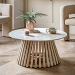 Arya coffee table styled in a cosy living room with books, candles, and ceramic décor
