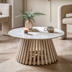 Arya coffee table styled in a cosy living room with books, candles, and ceramic décor