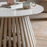 Close-up of the open pedestal base crafted from solid mango wood