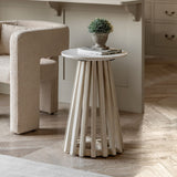 Arya side table styled in a cosy living room with modern armchair and decor books