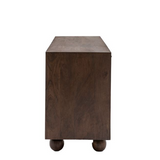 Wooden side table with round legs on a white background