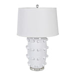  Crafted from sleek white ceramic and adorned with elegant bobble detailing, this lamp comes complete with a crisp white shade. 