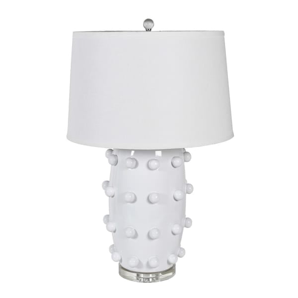  Crafted from sleek white ceramic and adorned with elegant bobble detailing, this lamp comes complete with a crisp white shade. 