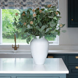 A stunning tapered white stoneware vase