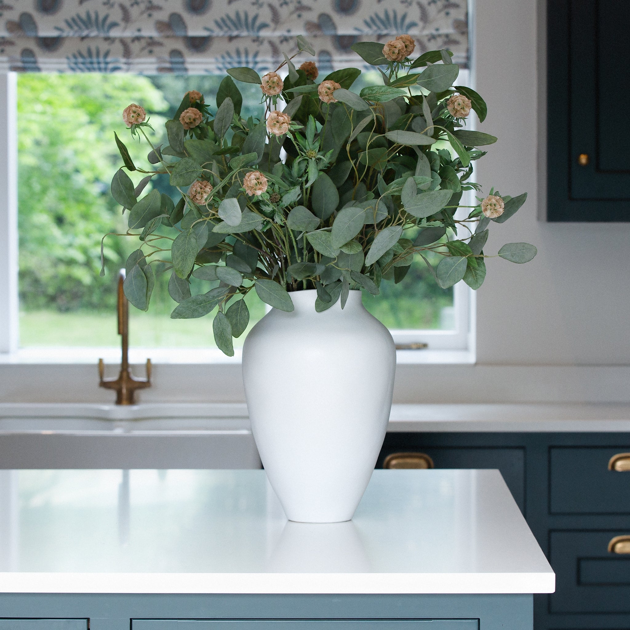 A stunning tapered white stoneware vase