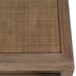 Close-up of woven rattan shelf on bayur wood coffee table