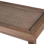 Detailed top view of the rattan texture and wood frame of the console table