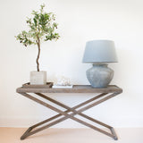 This remarkable oak Console table is meticulously constructed from weathered oak and boasts a detachable tray. The table's luxurious grey finish is made from aged oak and oak veneer, and it also includes one removable tray and striking crossed legs, showcasing its mesmerizing grain.

Dimensions:


W 150cm D 40cm H 80cm


22kgs