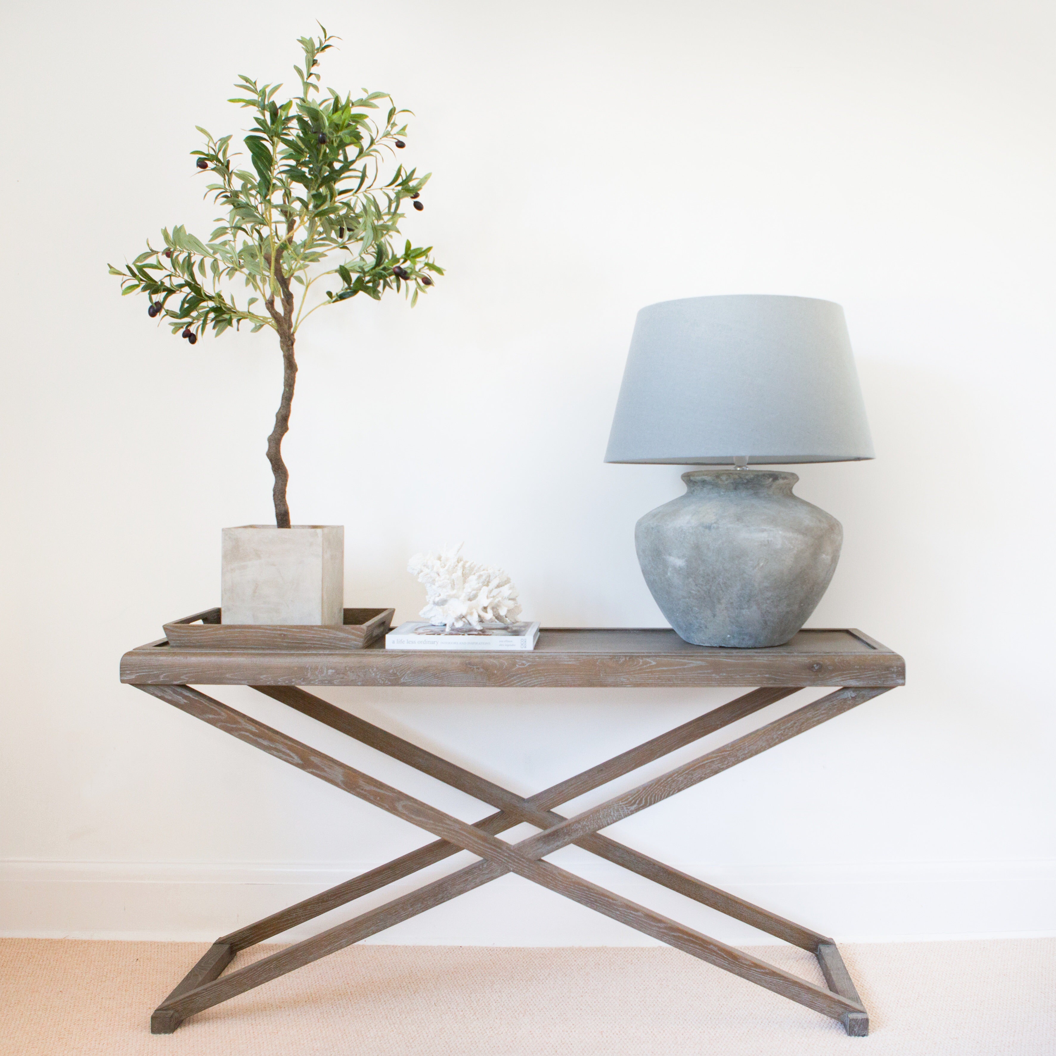 This remarkable oak Console table is meticulously constructed from weathered oak and boasts a detachable tray. The table's luxurious grey finish is made from aged oak and oak veneer, and it also includes one removable tray and striking crossed legs, showcasing its mesmerizing grain.

Dimensions:


W 150cm D 40cm H 80cm


22kgs