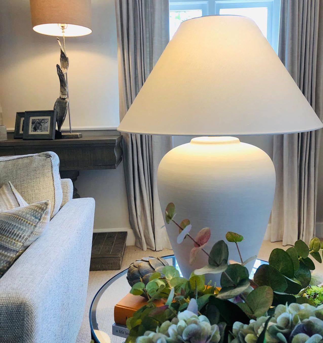 Bianca Oversized White Ceramic Table Lamp with wide shade styled in living room