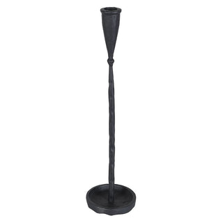 A black cast iron candlestick holder with a textured finish, featuring a tapered top, a twisted stem, and a round base, shown against a plain white background.