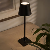 Elegant Maja Wireless Lamp with warm lighting on bedside table