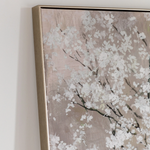 Framed artwork of a floral design on a neutral background